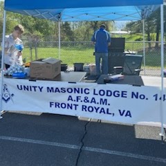 Will Bryan starts off early in the day grilling hot dogs for the All Children Matter Jubilee on April 15, 2023 at the Masonic canopy booth.
