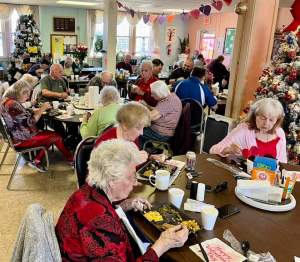 Senior Citizens enjoying a Valentines Day meal at the Warren County Senior Center prepared and served by the freemasons.