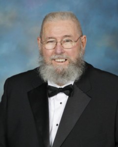 Portrait of Charles R. Seaford, PDDGM dressed in a black suite and a bowtie.