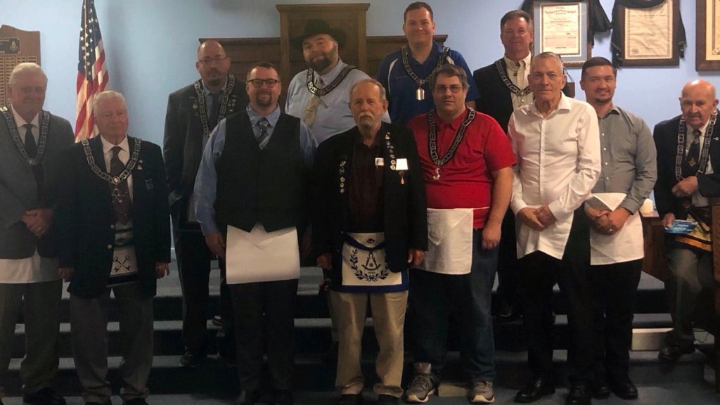 Masonic Brother Anthony Fisher stands proud to done his apron among brothers after his first degree in Masonry on August 16, 2023
