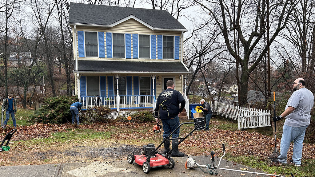 Scott, Mike, Bill, Sam, and Gabriel get started cleaning up the yard
