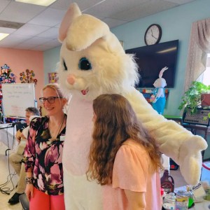 Two staff of the Warren County Senior Center pose with the Easter Bunny on April 4, 2023