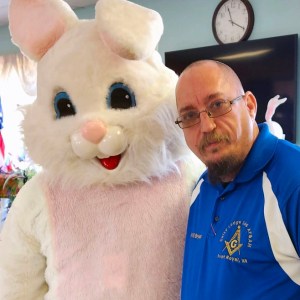 Will Bryan poses with the Easter Bunny at the Warren County Senior Center on April 4, 2023