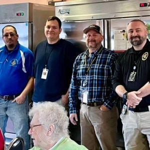 WM Will Bray, Jacob Witzen, WCSS Staff, and Terry Fritts wait patiently together to serve food a the Warren County Senior Center on February 14, 2023.jpg