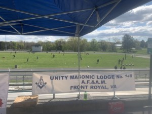 Overlooking the field of players at the 1st Annual Youth Football Camp on April 17, 2021 with a Unity Masonic Lodge No 146 banner.