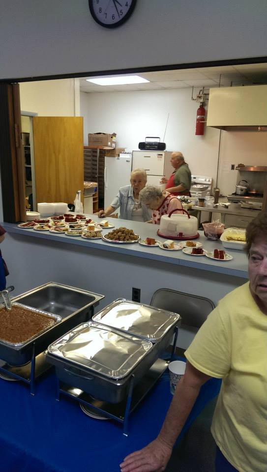 Food and cake at Bill Woods 90th Birthday celebration