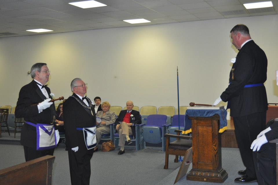 Brother Davidson presents Brother Hammack as Junior Warden-elect.