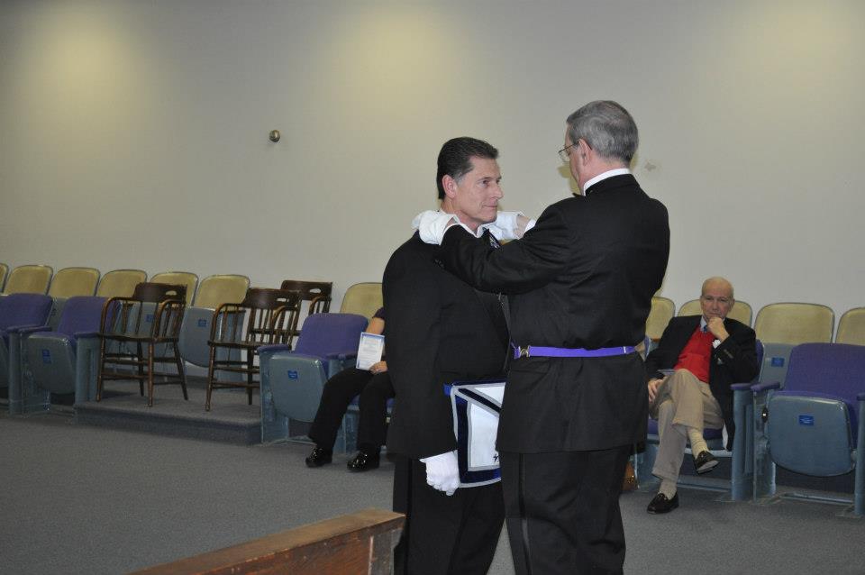 Brother Davidson presents the treasurer jewels to Craig Wheeler.