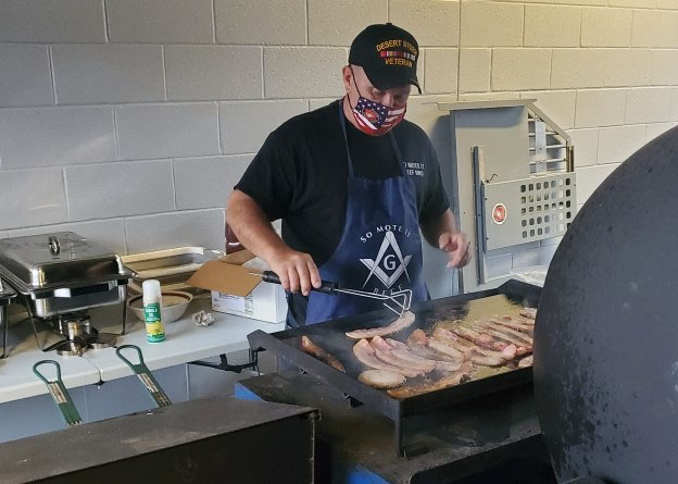 Brother Tom Kivlehan cooking with So mote it beef bbq on veterans day 2020