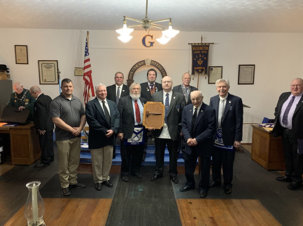 Brothers from Unity Lodge No. 146 receive the traveling gavel from Washington Lodge No. 78 in February 2020