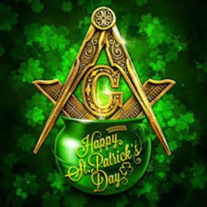 Freemasonry square and compass setting on top of a green cauldron labeled "Happy St. Patricks's Day" in front of many green clovers.