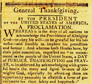 A newspaper clipping reads: General Thanksgiving, by the president of the United States of America, A proclamation. Whereas it is the duty of all nations to acknowledge the providence of Almighty God, to obey His will, to be grateful for His benefits, and humbly to implore His protection and favor; and Whereas both Houses of Congress have, by their joint committee, requested me to “recommend to the people of the United States a day of public thanksgiving and prayer, to be observed by acknowledging with grateful hearts the many and signal favors of Almighty God, especially by affording them an opportunity peaceably to establish a form of government for their safety and happiness:”