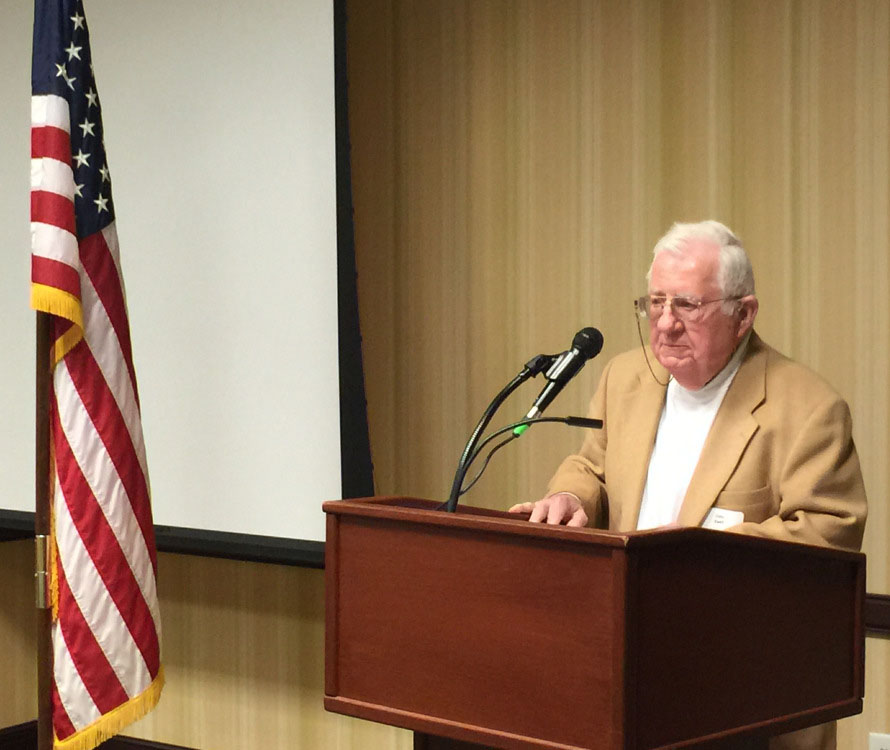 John Ewell addresses the dinner.