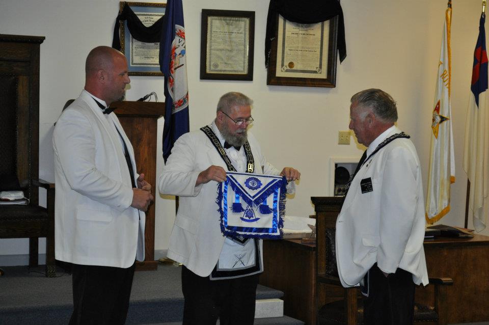Charlie Seekford presents Eddie Powell with a Past Master apron. - with Scott Cabazolo at Unity Masonic Lodge No. 146 AF & AM.