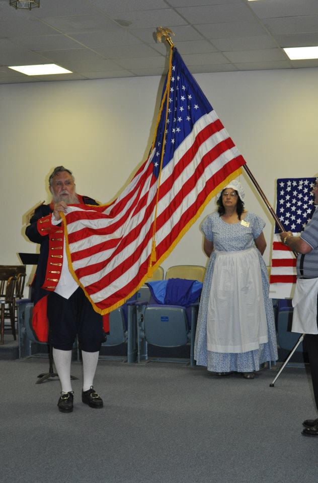 Charlie Davis toasts the American Flag