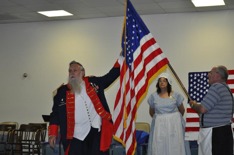 Charlie Davis toasts the American Flag