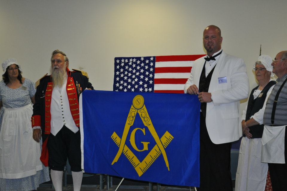 Charlie presents Scott the Masonic emblem flag. - with Scott Cabazolo.