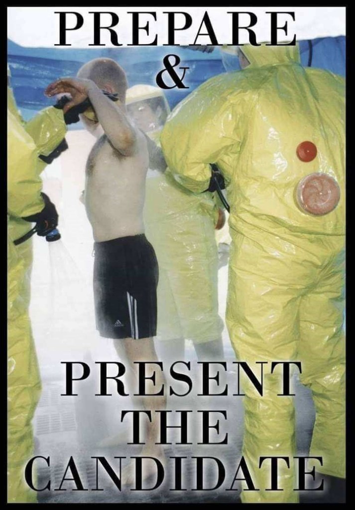 During the pandemic, three men in yellow biohazard suites are seen spraying down a man who is only wearing shorts with the text, "Prepare & Present the candidate".
